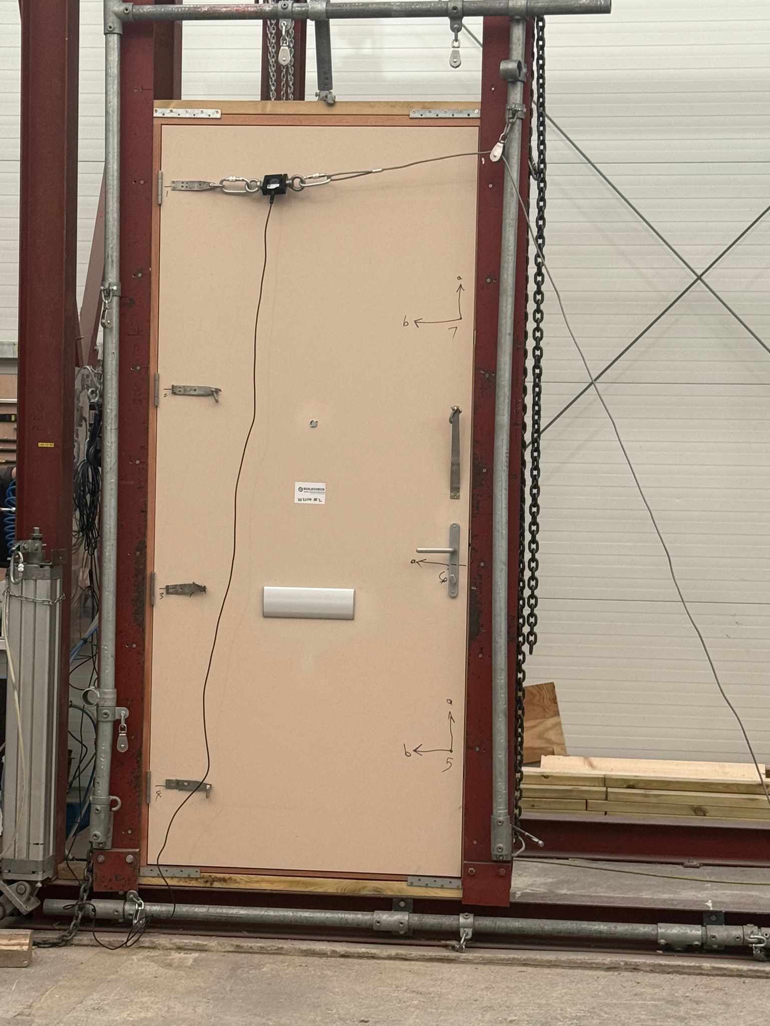 Fire door specimen undergoing PAS 24 security testing